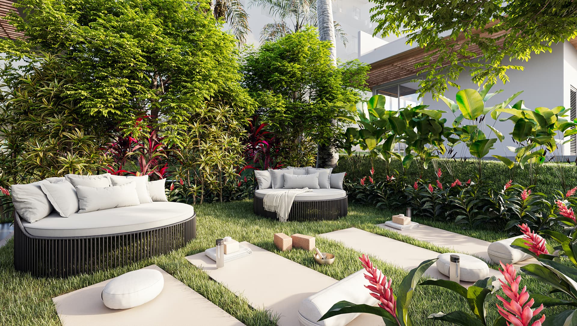 Espaço zen do Uni com chaises redondas, tapetes de yoga e jardim tropical